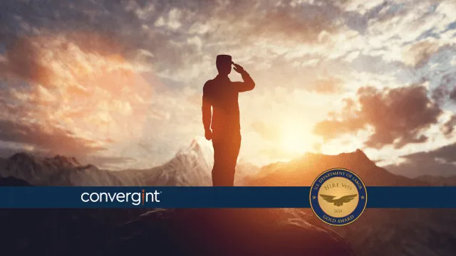 Veteran saluting on top of a mountain