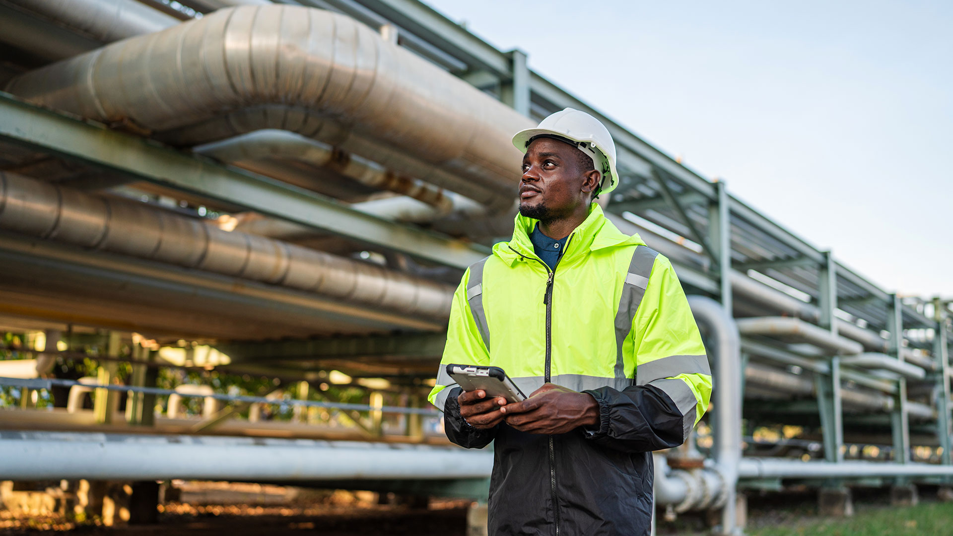 worker inspecting pipe 
