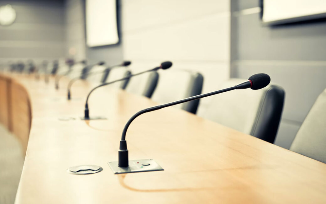 Close-up of microphones in a conference room