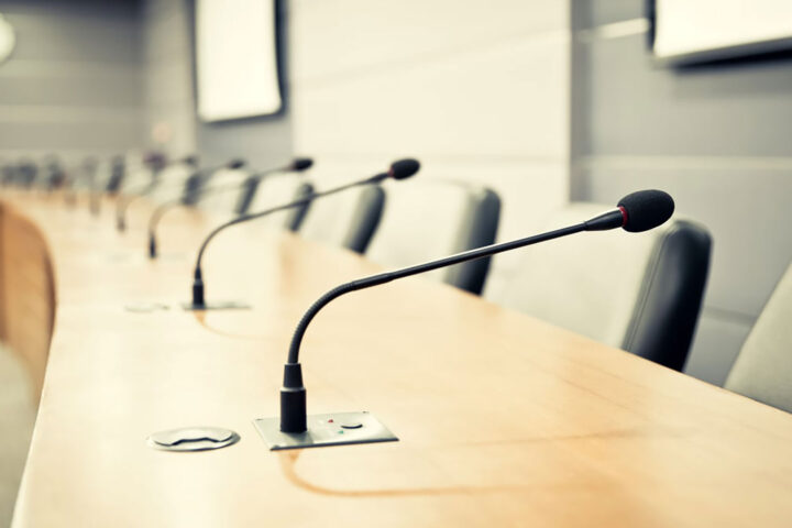 Close-up of microphones in a conference room