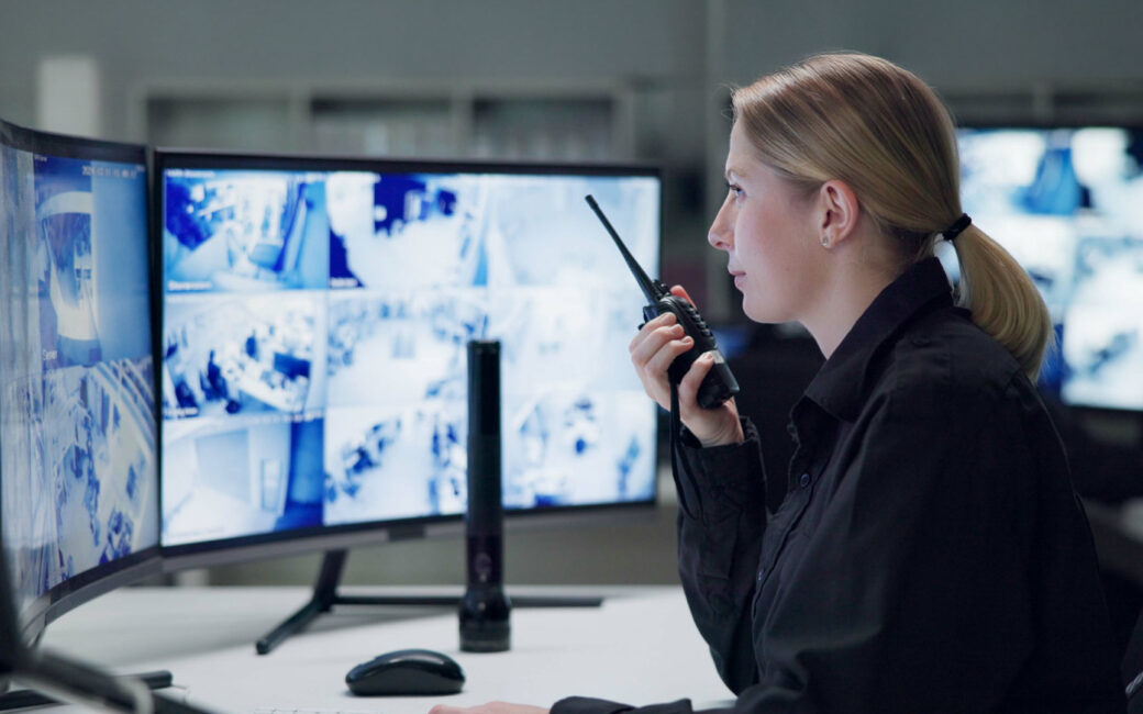 Watch, security and woman with radio, cctv and monitor for danger, talking and control room for gua