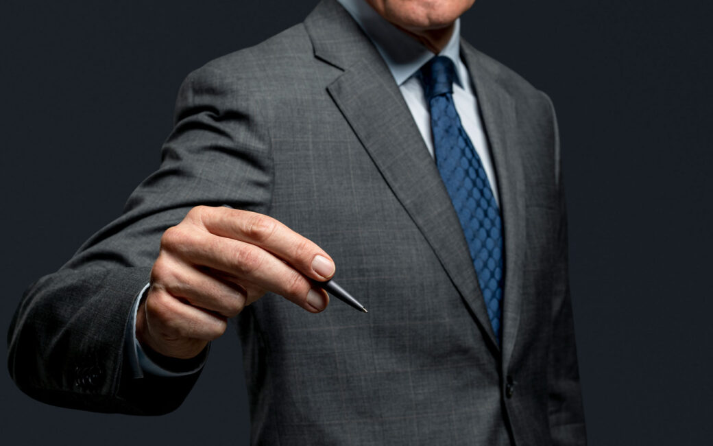 Businessman using a pen and signing