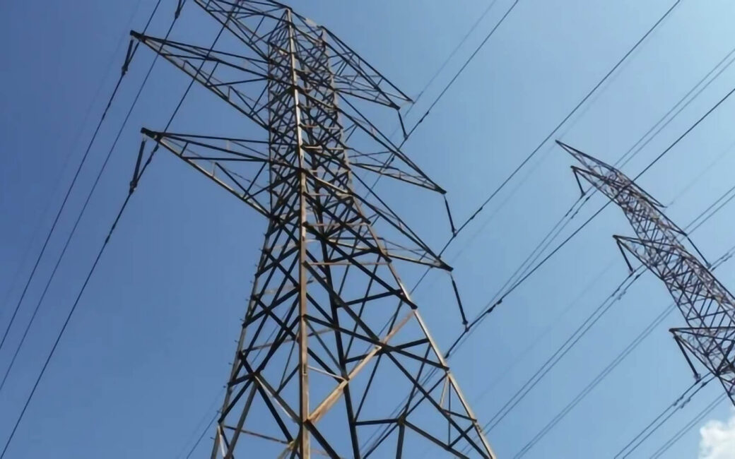 an exterior shot of power line towers